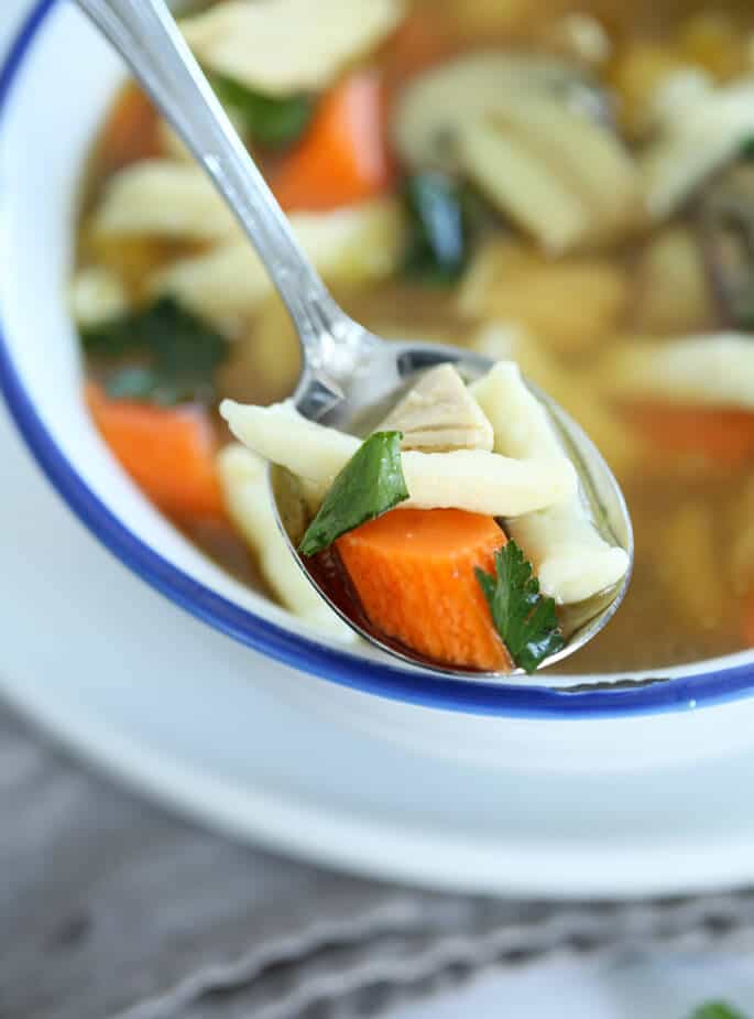 This rustic gluten free chicken noodle soup is made with rich chicken stock and easy homemade dumplings. A one pot dinner!