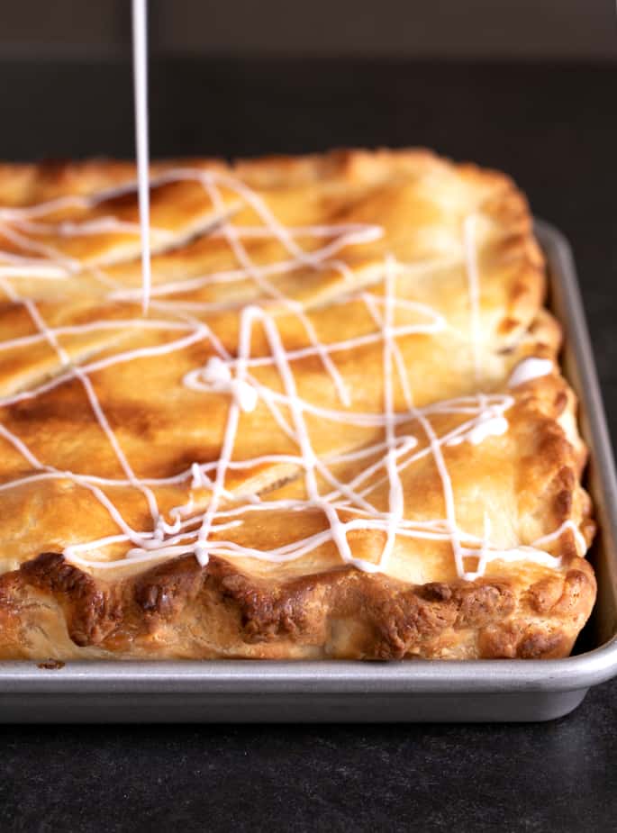 This gluten free apple slab pie is packed with apples cooked to tender perfection and surrounded by an extra flaky, lightly sweet pie crust. The perfect way to feed a crowd!