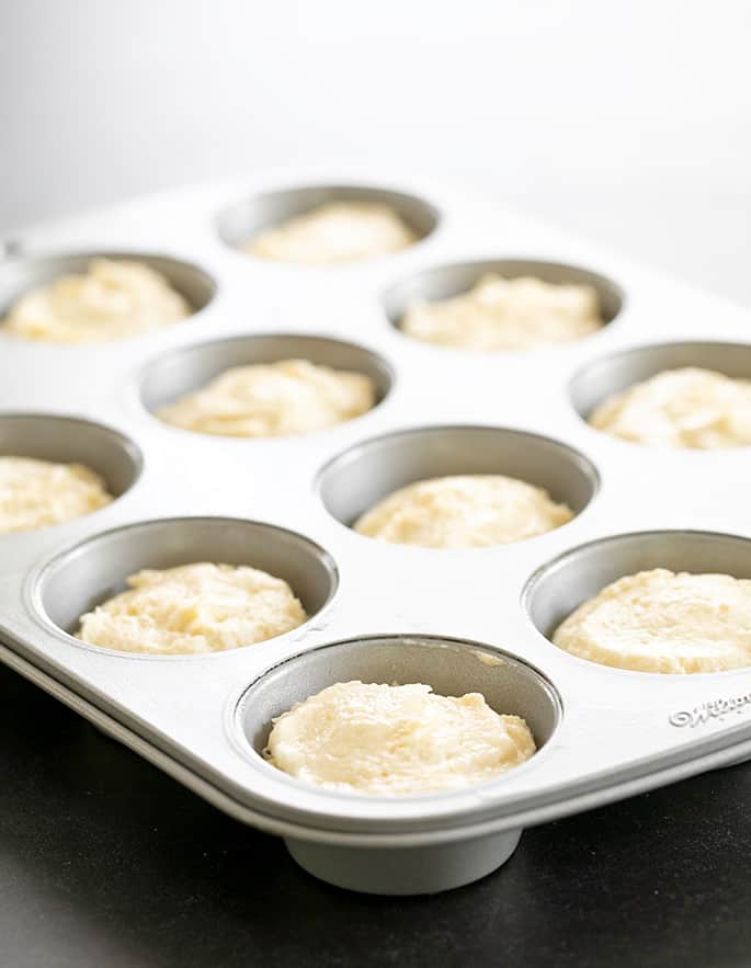 Lemon cupcakes batter raw in muffin tin