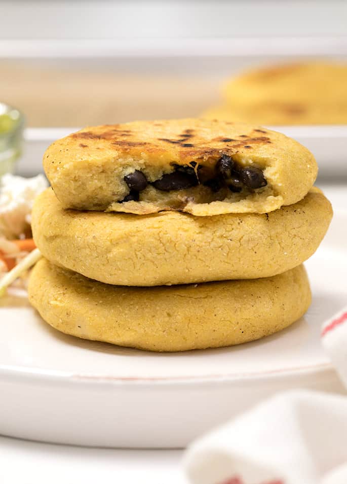 This pupusas recipe for stuffed corn cakes is for when the cupboards are nearly bare, and you need a hearty handheld meal—and you need it fast!