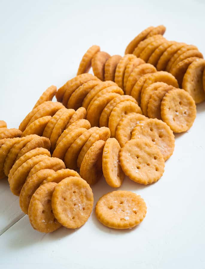 5 rows of Ritz-Style crackers on a white surface