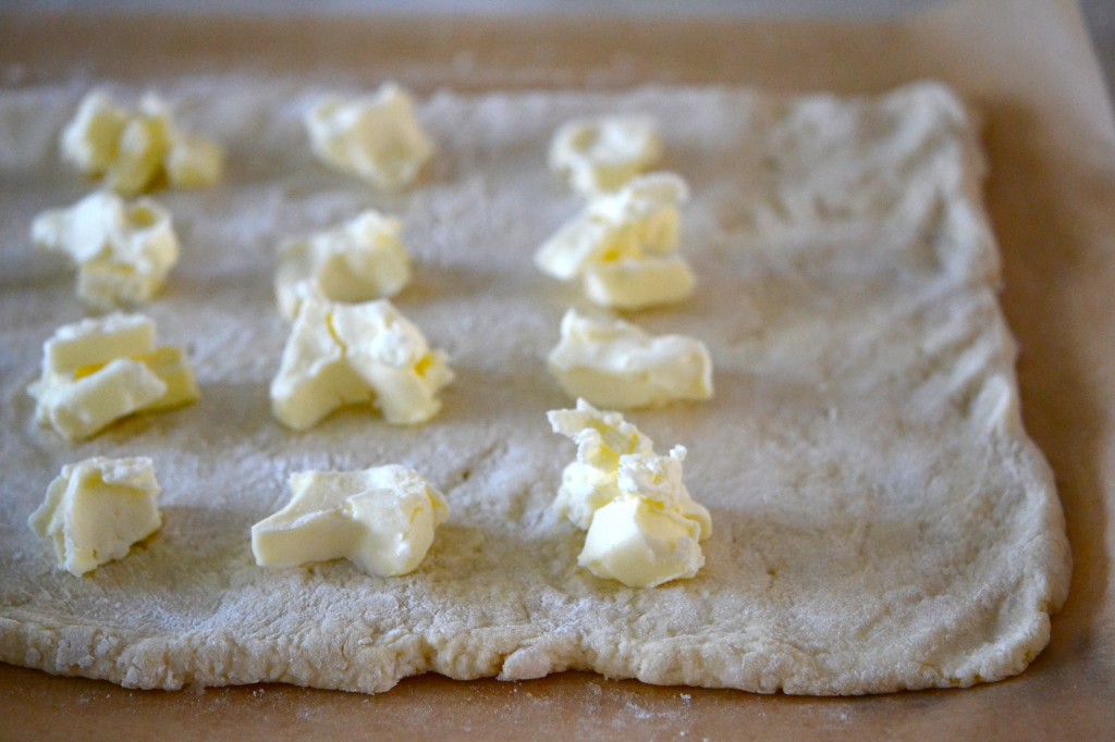 Flattened dough with topping on top