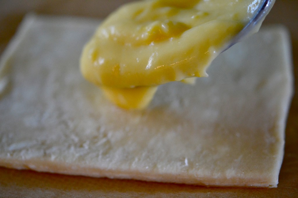 Custard bring placed on top of dough