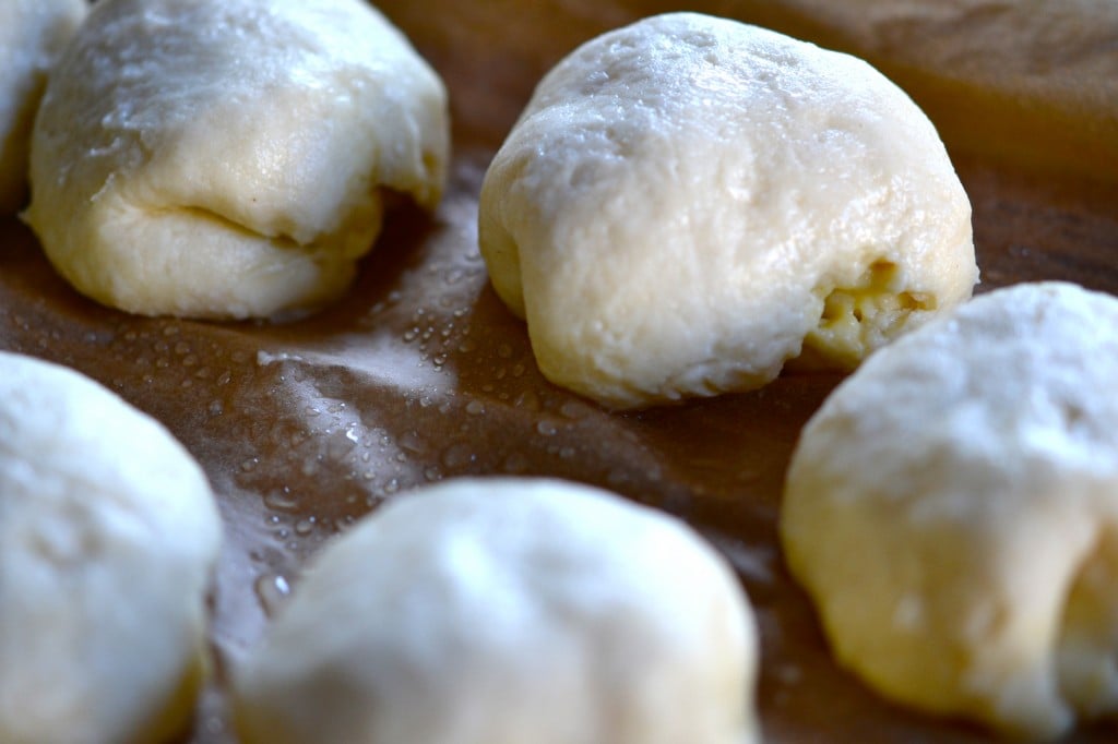 Raw pastries on brown surface 