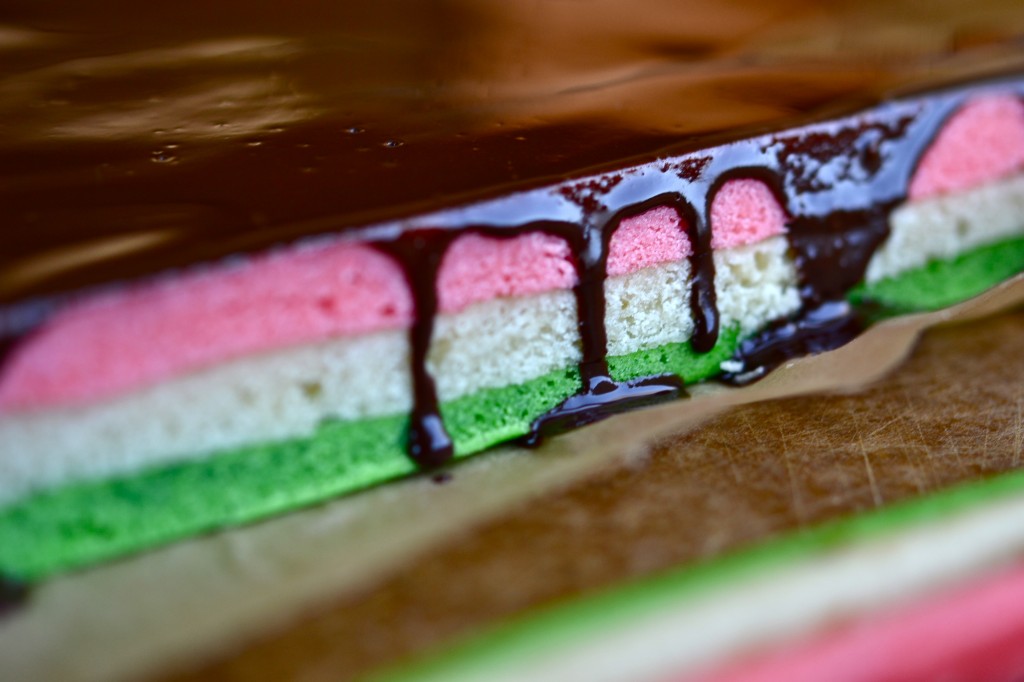 A close up of a rainbow cake