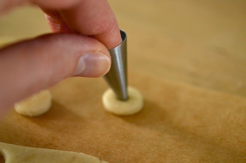 Dough being shaped on brown surface 