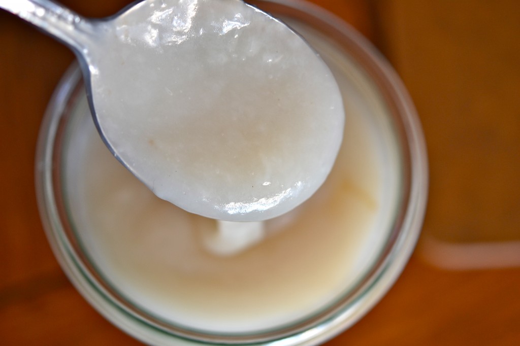 A close up of white liquid on a spoon