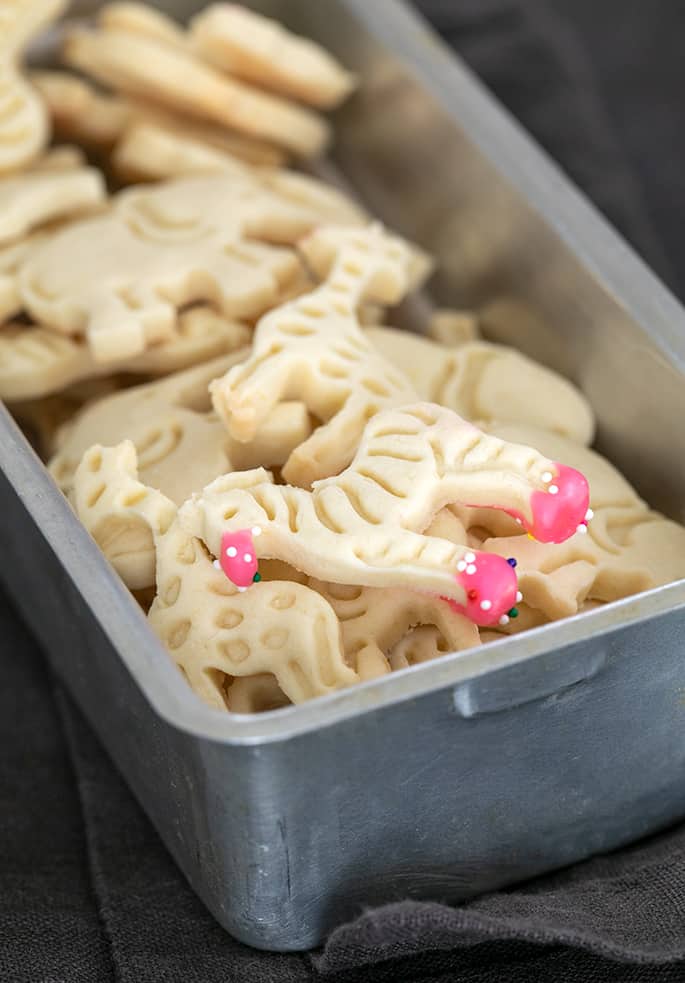 Metal tin with animal crackers mostly without frosting