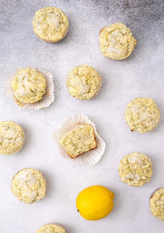 Lemon Poppyseed muffins overhead image with one cut in half