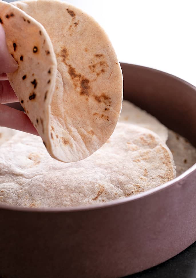 Person holding a tortilla