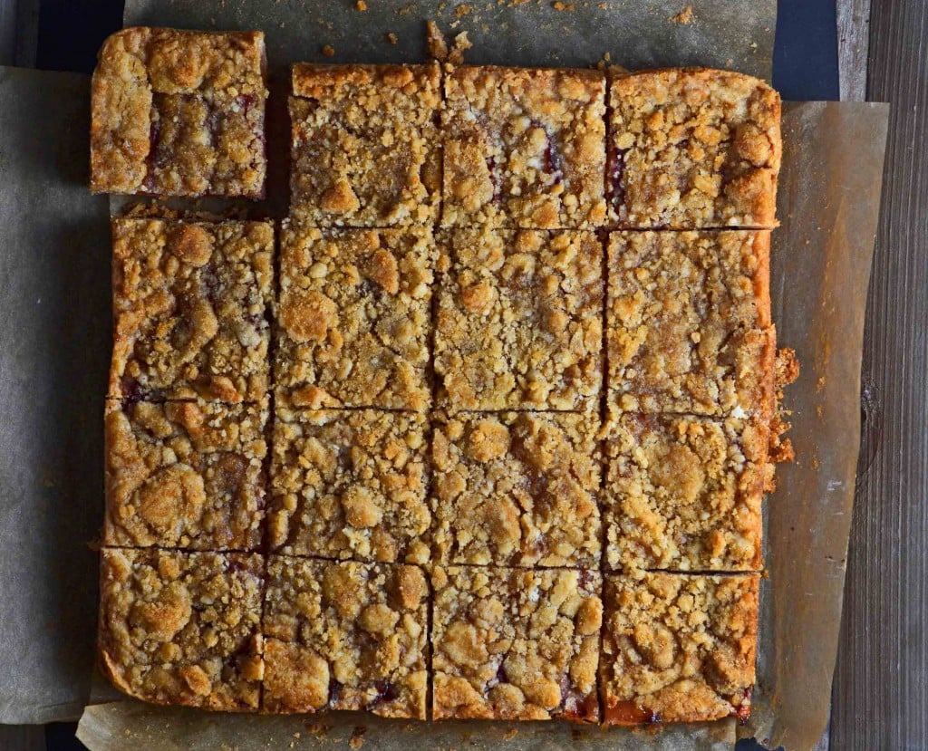 Sliced plum crumble on brown surface