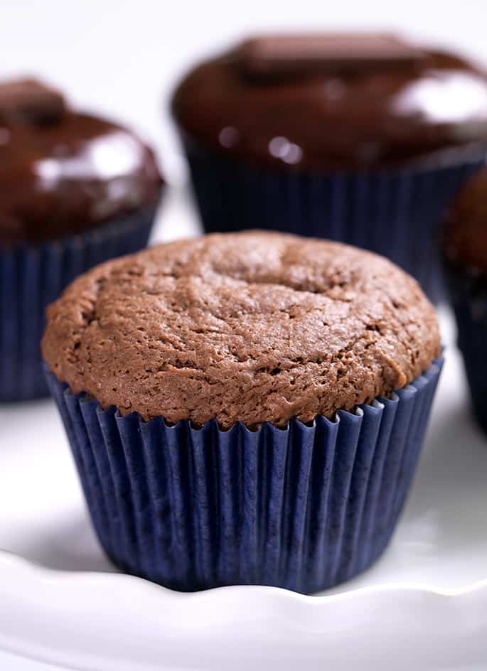 Baked milk chocolate cupcake without glaze and others with glaze