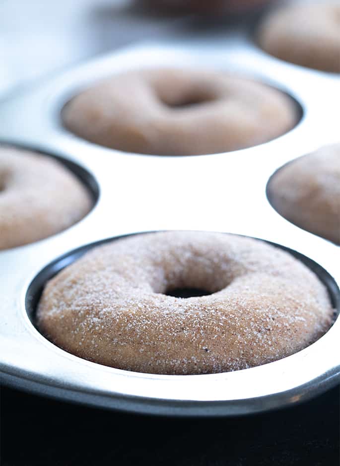 This easy gluten free apple cider donuts recipe is the cure for what ails you when you go to the apple orchard—but can't buy their sweet-smelling baked goods!