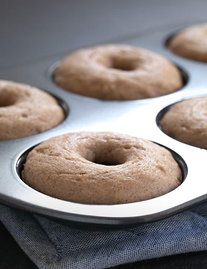 This easy gluten free apple cider donuts recipe is the cure for what ails you when you go to the apple orchard—but can't buy their sweet-smelling baked goods!