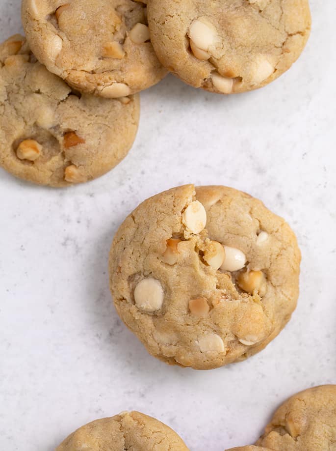 Overhead image of array of white chocolate macadamia nut cookies