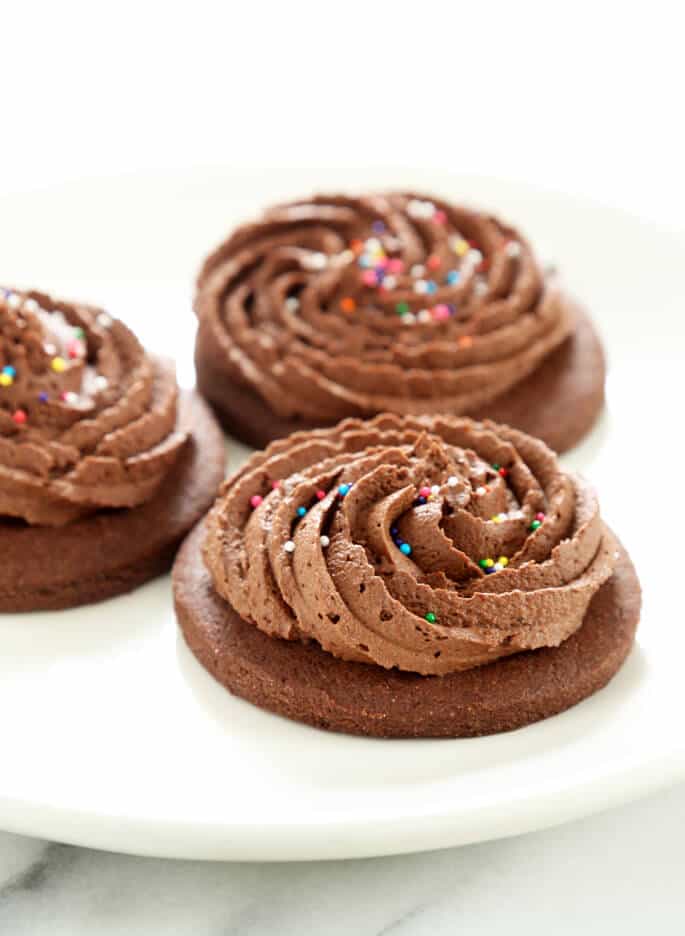 These gluten free soft chocolate cutout sugar cookies roll out so easily and hold their shape during baking. Perfect for any holiday!