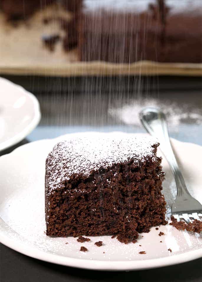 Rich chocolate and warm spices earn this moist and flavorful chocolate gluten free gingerbread cake a place of honor at your holiday table.