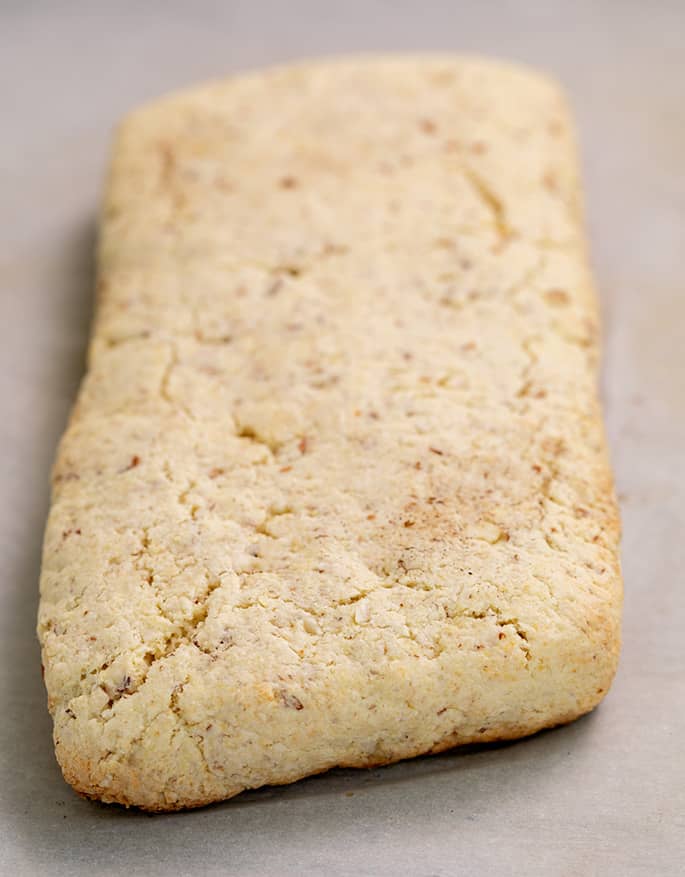 Baked uncut biscotti rectangle on white paper