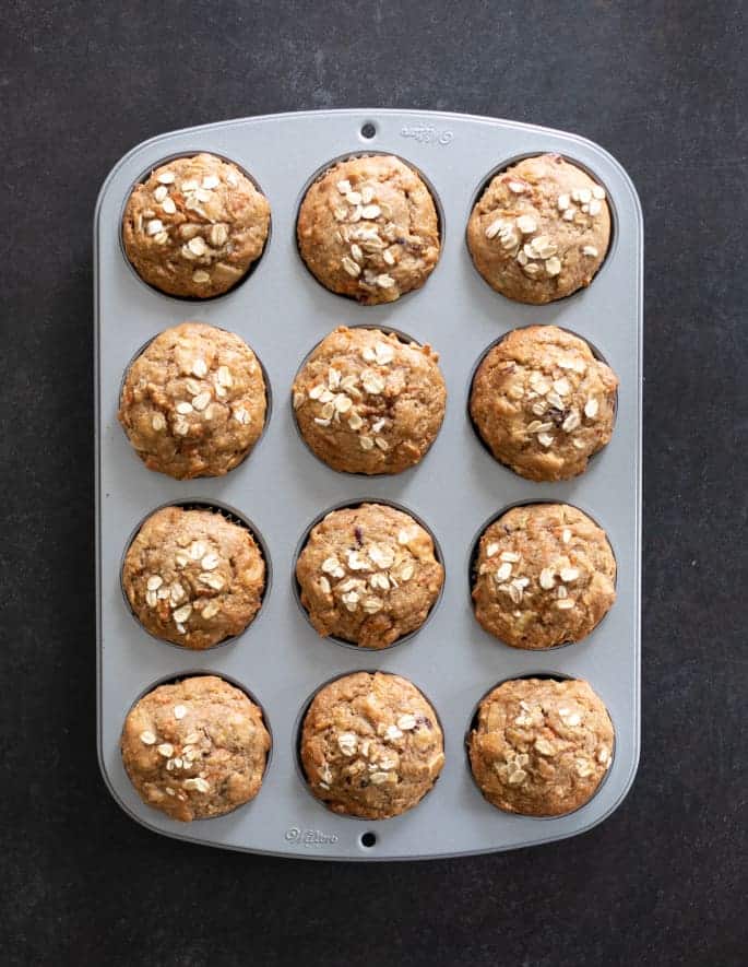 Lightly sweet gluten free morning glory muffins are packed with carrots, apples, coconut, and dried fruit. A super satisfying, healthy breakfast.