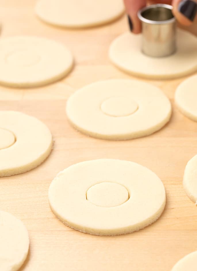 Round cuout cookies with center circle being cut out