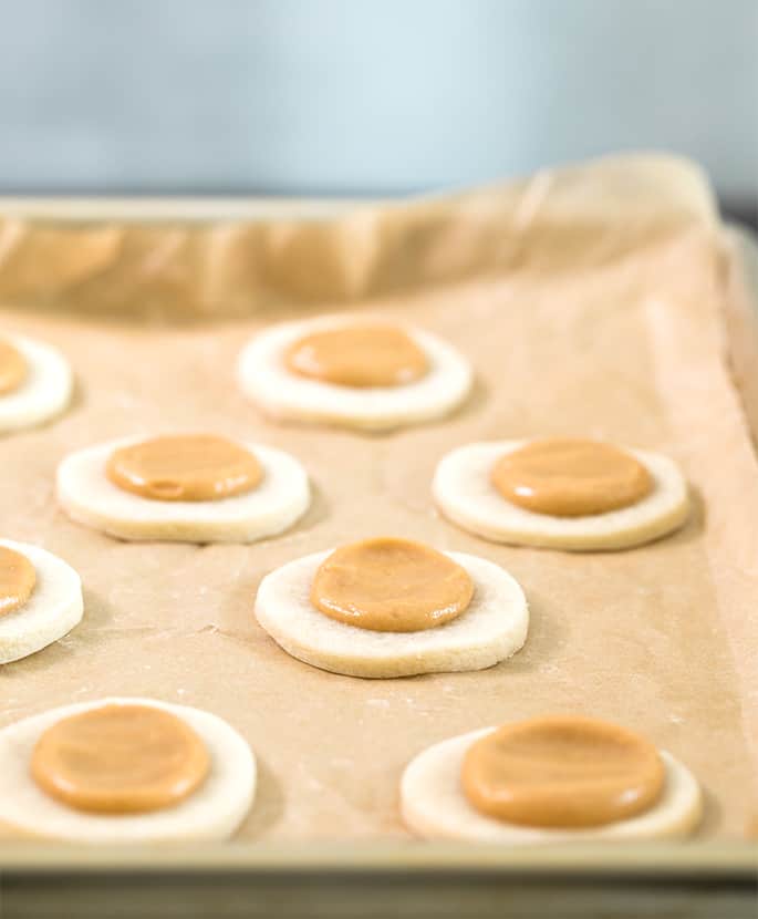 Sugar cookies with peanut butter on a tray