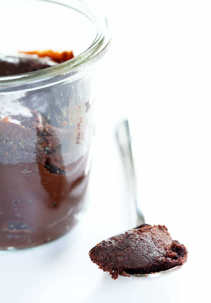 A close up of a chocolate cake on a spoon