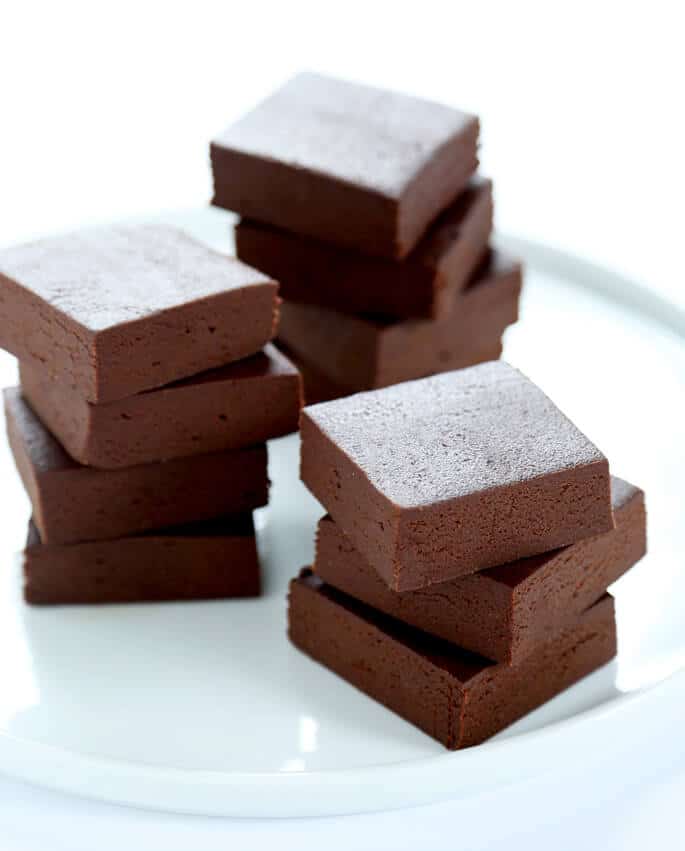3 stacks of fudge on a white plate
