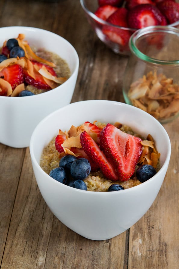 White bowl with breakfast quinoa and fruit 