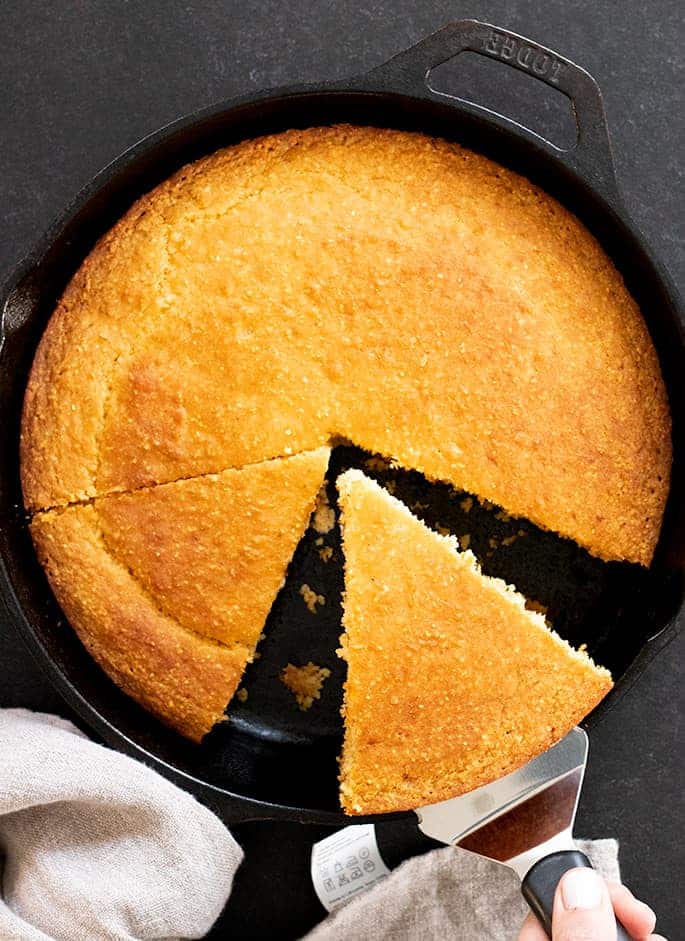 Old Fashioned gluten free cornbread all purpose flour variation, being sliced and served.