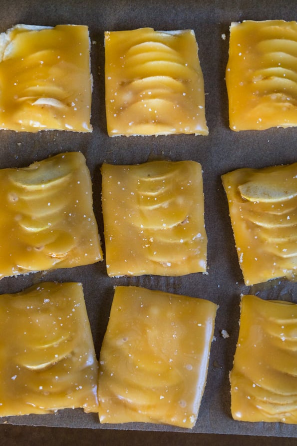 Overhead view of Caramel Apple Shortbread Squares on brown surface 