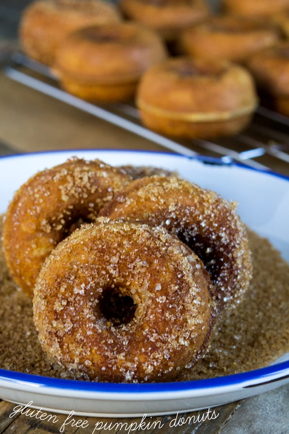 Donuts being coated in sugar 