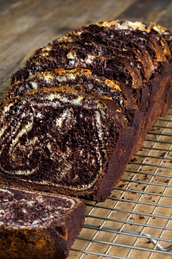 A close up of a piece of marble loaf cake