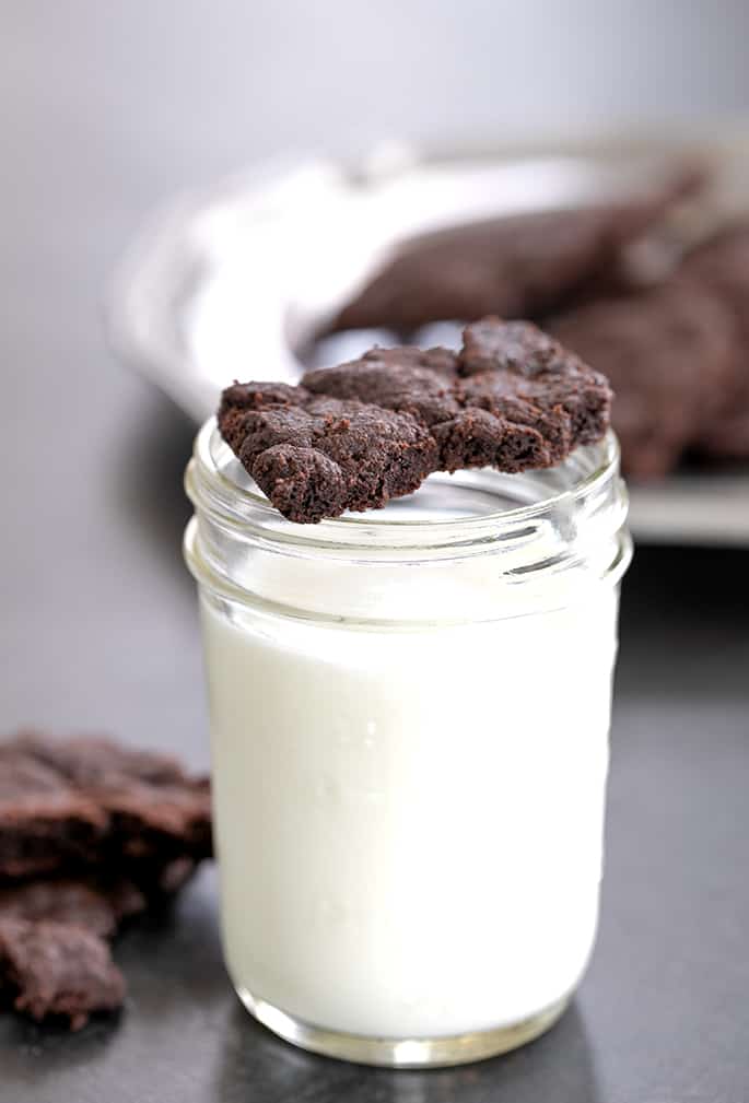 Gluten free brownie crisps on glass of milk