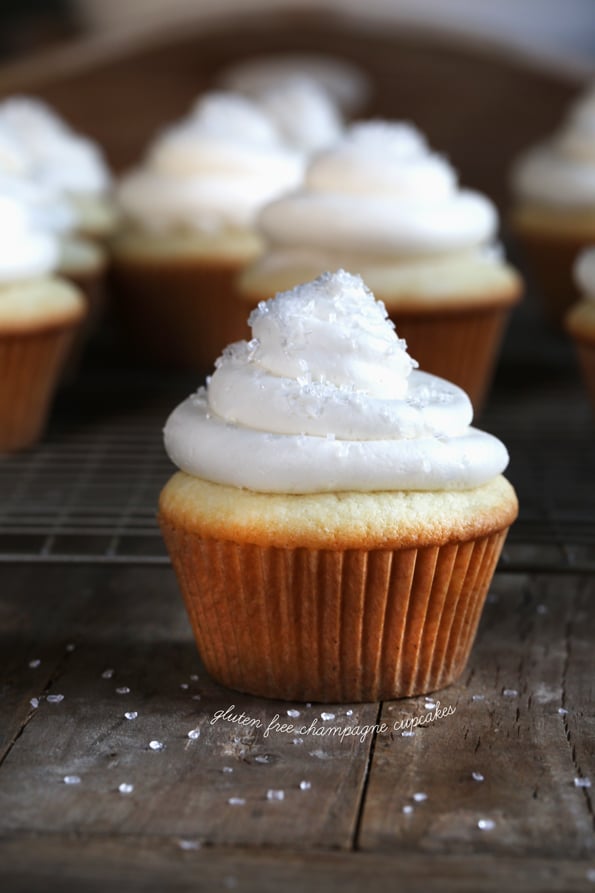 Gluten free champagne cake. A light, fluffy yellow cake made with champagne in the batter, and a super easy 7-minute frosting. Try a nonalcoholic version with ginger ale, and share it with the kids!