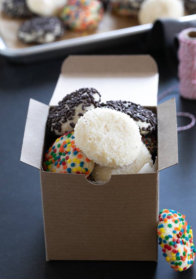 A box filled with different types of drop sugar cookies