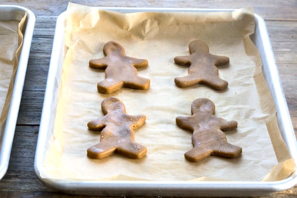 Gingerbread men cookie dough on metal tray