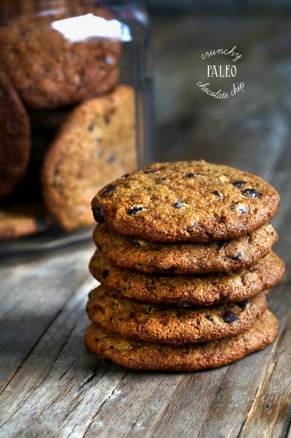 Stack of chocolate chip cookies on wooden surface 