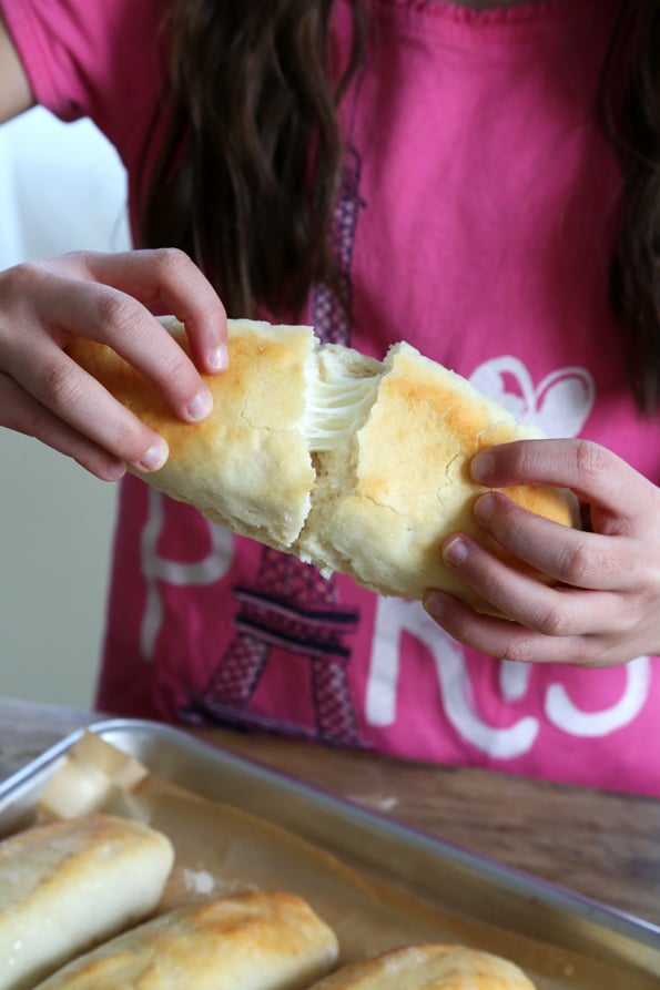 Person pulling breadstick 