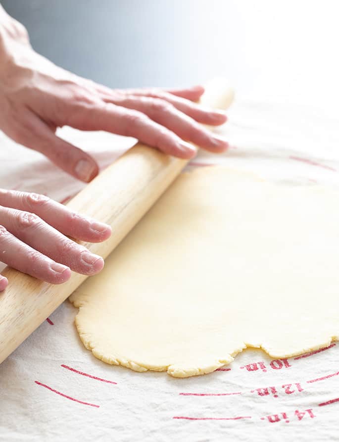 Rolling out won ton wrapper dough on Bethany pastry board and cloth