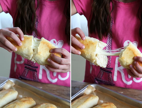 A woman holding a breadstick 