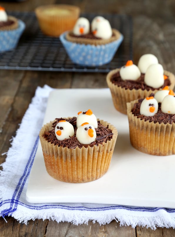 Chick cupcakes on white surface 