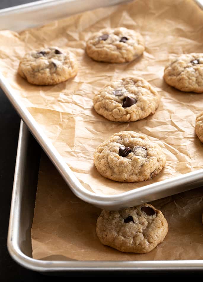 Two trays of peanut butter oatmeal chocolate chip cookies