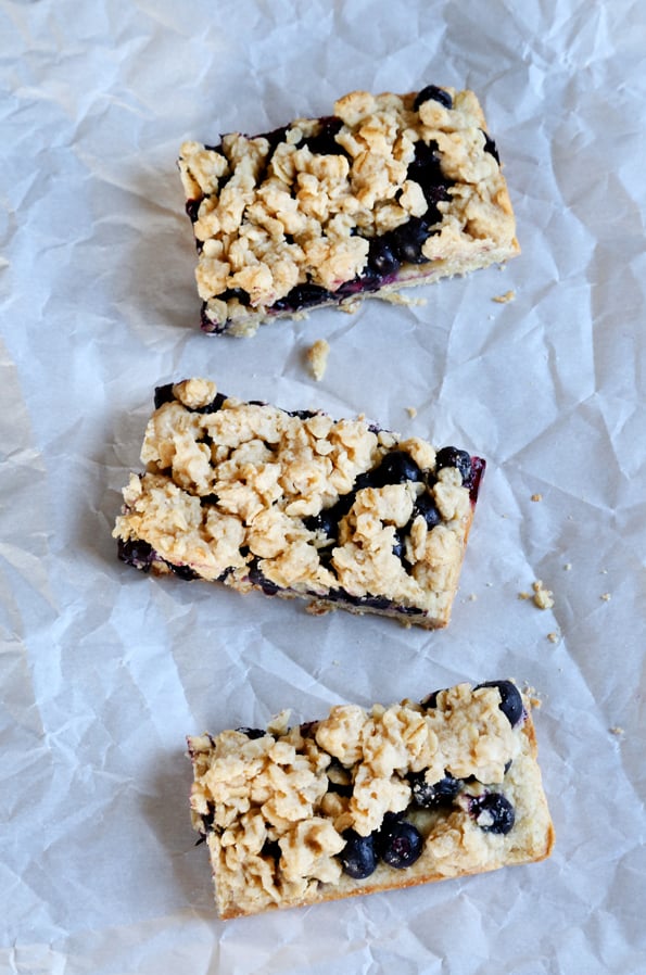 Blueberry oat bars on white surface 