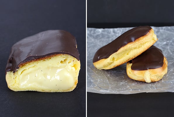 Close up of chocolate eclairs on black surface 