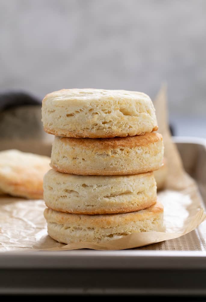 Gluten free angel biscuits in a stack of 4 biscuits on a tray.