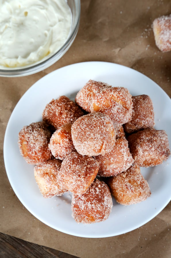 An overhead view of pretzel bites on white plate 