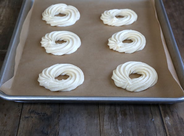 Donut dough on metal tray