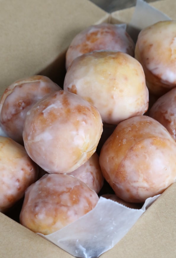 A closeup image of donuts in a box