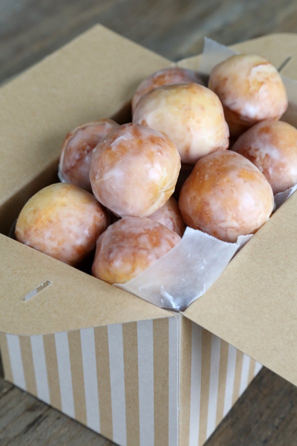 A box of doughnuts on a table