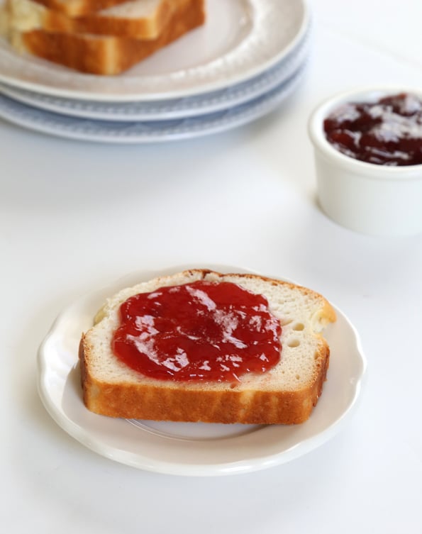 Bread with jam on a white plate 